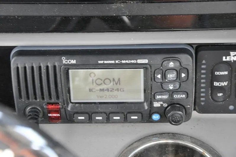 Slide: The Image of ICOM IC-M424G marine radio on 2023 Robalo R272 Center Console boat dashboard. - 26