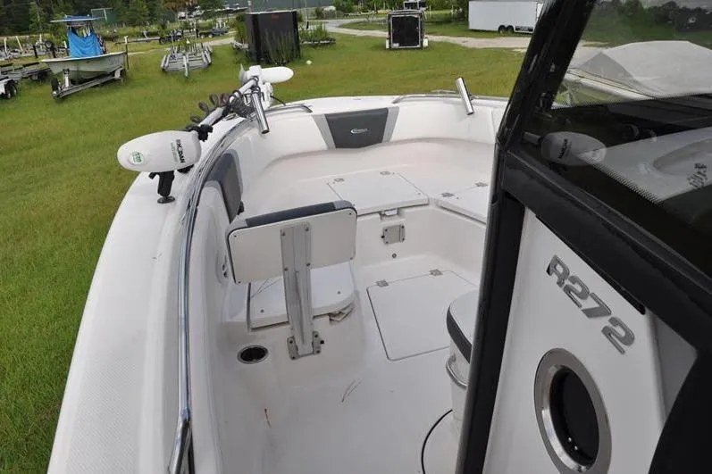Slide: The Image of 2023 Robalo R272 Center Console boat interior with seating and storage compartments. - 27