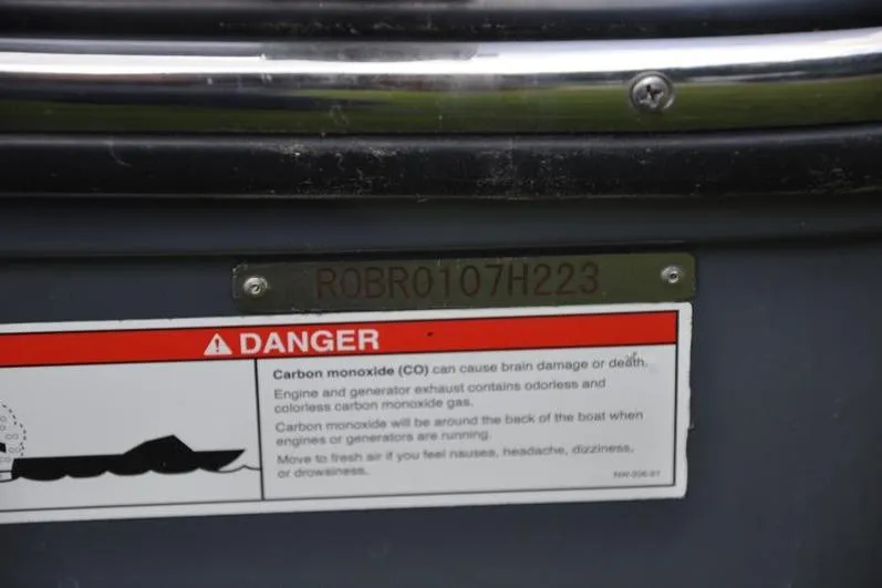 Slide: The Image of 2023 Robalo R272 Center Console warning label with carbon monoxide danger notice. - 35