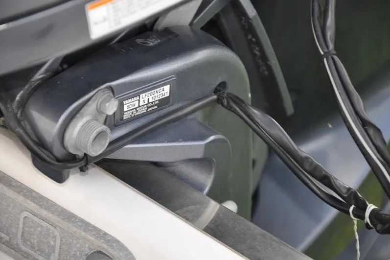 Slide: The Image of Close-up of Yamaha engine component on 2023 Robalo R272 Center Console boat. - 36