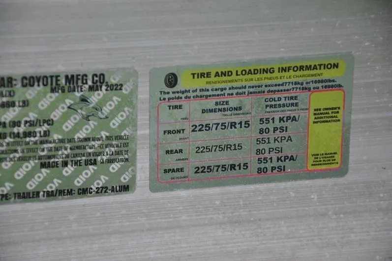 Slide: The Image of Tire and loading information label for 2023 Robalo R272 Center Console boat trailer. - 39