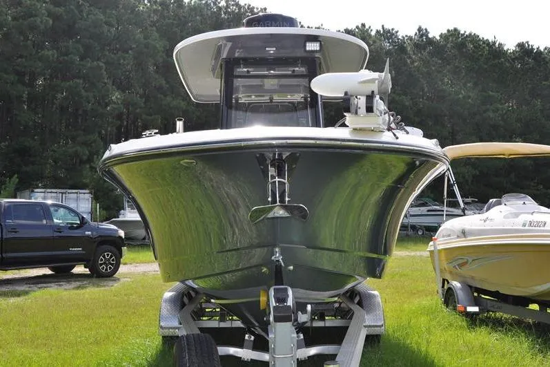 Slide: The Image of 2023 Robalo R272 Center Console boat on trailer, parked outdoors. - 5