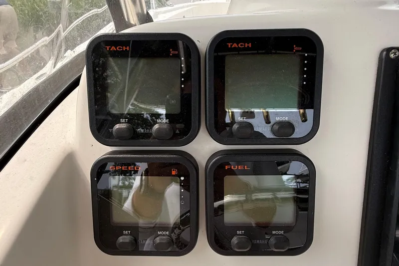 Slide: The Image of 2008 Pursuit C 280 Center Console boat on calm waters near residential area. - 15