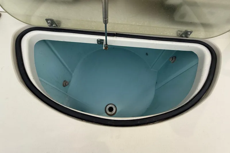 Slide: The Image of Open storage compartment on 2008 Pursuit C 280 Center Console boat. - 9