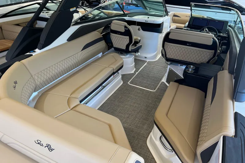 Slide: The Image of Luxurious interior of 2025 Sea Ray SLX 280 boat with beige seating and modern design. - 19