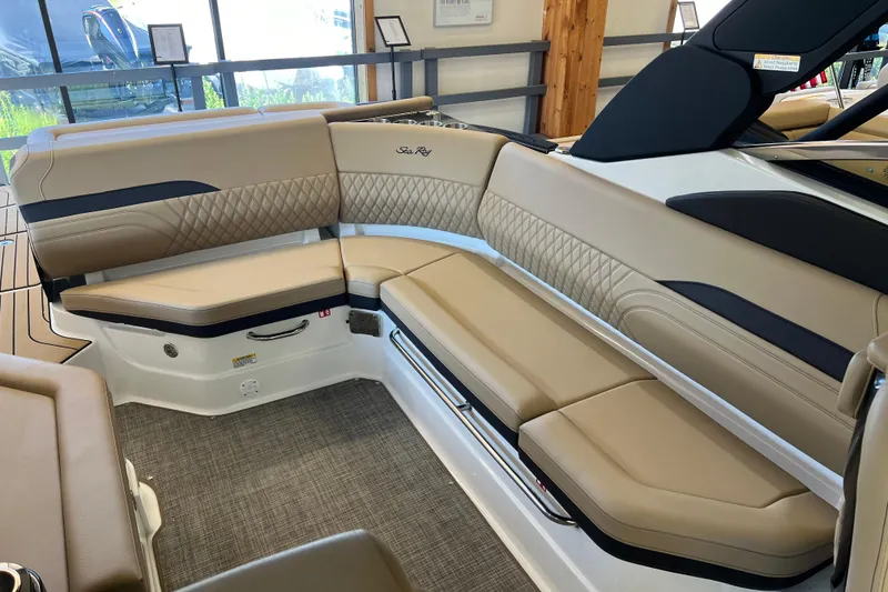 Slide: The Image of 2025 Sea Ray SLX 280 boat interior with luxurious tan seating and elegant design. - 20
