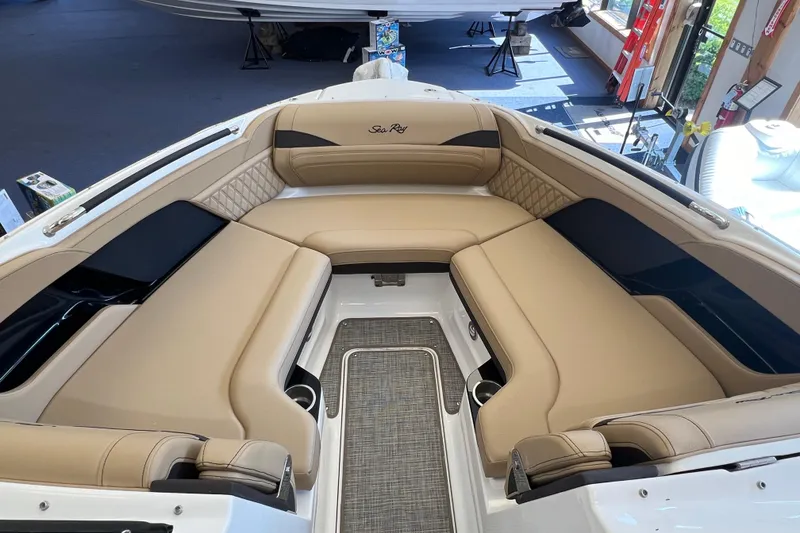 Slide: The Image of Luxurious interior of 2025 Sea Ray SLX 280 boat with beige seating. - 30