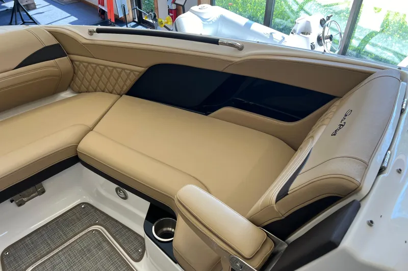 Slide: The Image of Luxurious interior seating of 2025 Sea Ray SLX 280 boat with tan upholstery. - 32