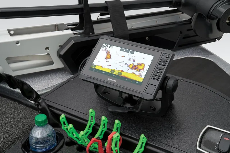 Slide: The Image of Manufacturer Provided Image: Fishfinder display on Nitro Z18 Pro 2026 boat dashboard with cup holder and clips. - 14