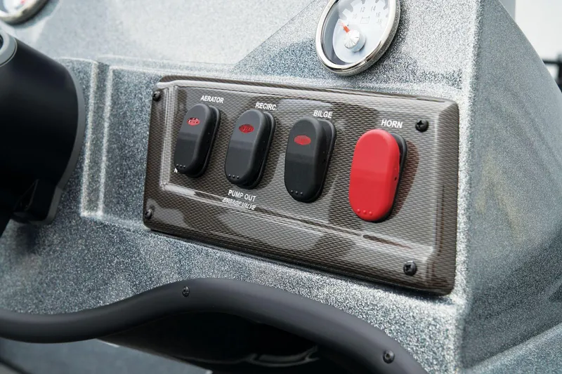 Slide: The Image of Manufacturer Provided Image: Control panel of 2026 Nitro Z18 Pro boat with switches and gauge. - 33