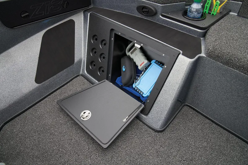 Slide: The Image of Manufacturer Provided Image: Storage compartment in 2026 Nitro Z18 Pro boat, featuring secure lock and organized interior. - 35