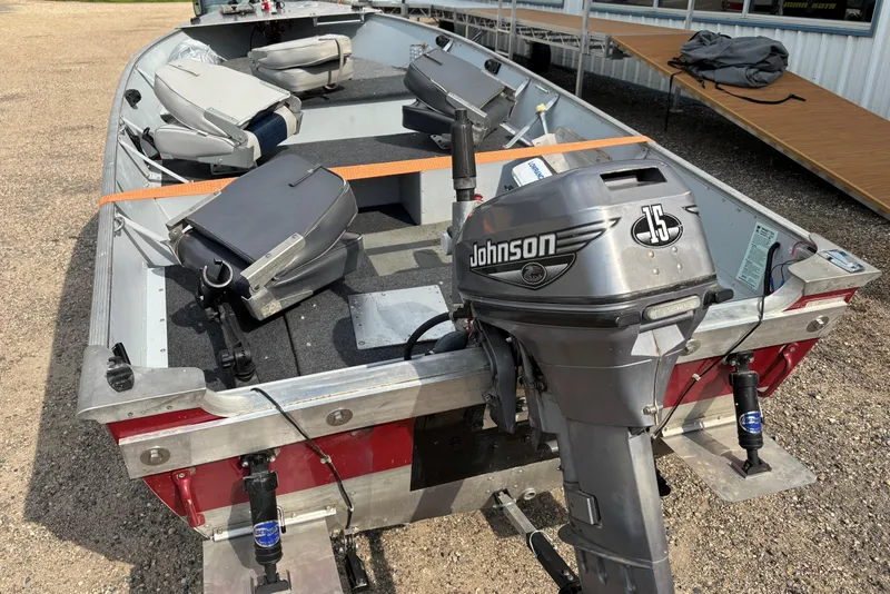 Slide: The Image of 1999 Lund SSV 14 Tiller boat with Johnson 15 outboard motor, interior view. - 3