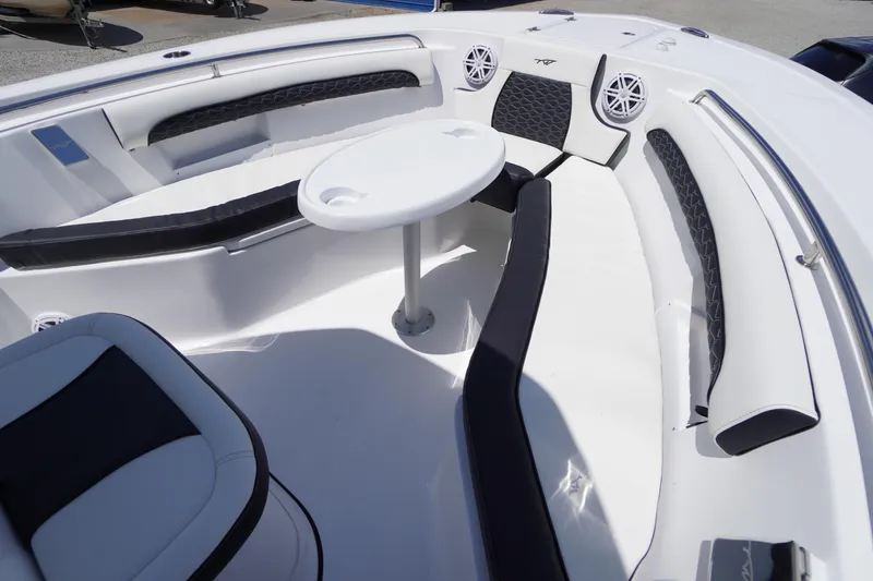 Slide: The Image of 2026 Tidewater 232 LXF boat interior with seating and table, featuring modern design. - 12