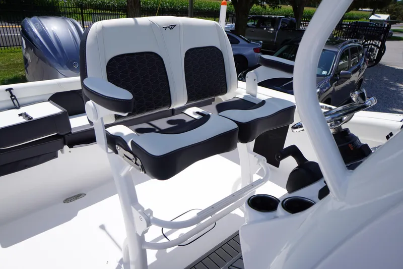 Slide: The Image of 2026 Tidewater 232 LXF boat interior with dual seating and steering console. - 38