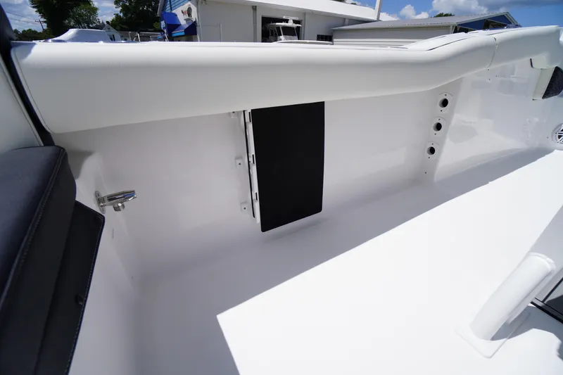 Slide: The Image of 2026 Tidewater 232 LXF boat interior detail with sleek white finish and modern design. - 44