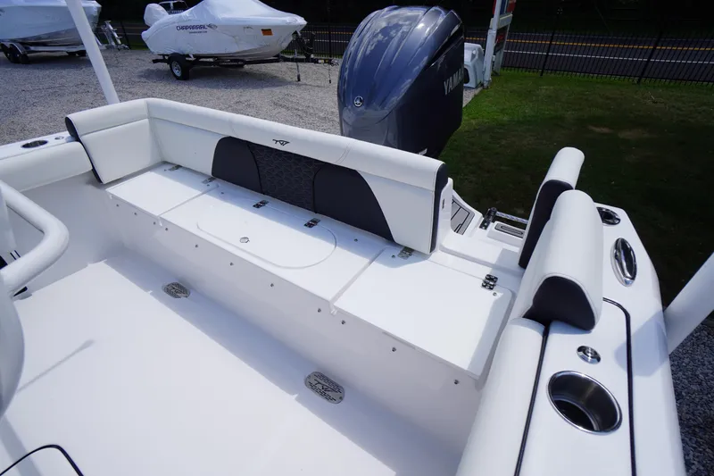 Slide: The Image of 2026 Tidewater 232 LXF boat interior with seating and Yamaha engine. - 47