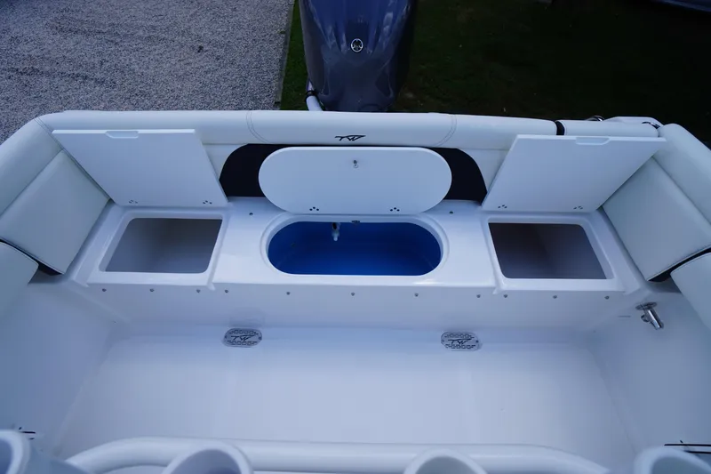 Slide: The Image of 2026 Tidewater 232 LXF boat interior with storage compartments and seating. - 50