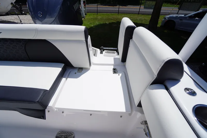Slide: The Image of 2026 Tidewater 232 LXF boat interior with white and black seating. - 56