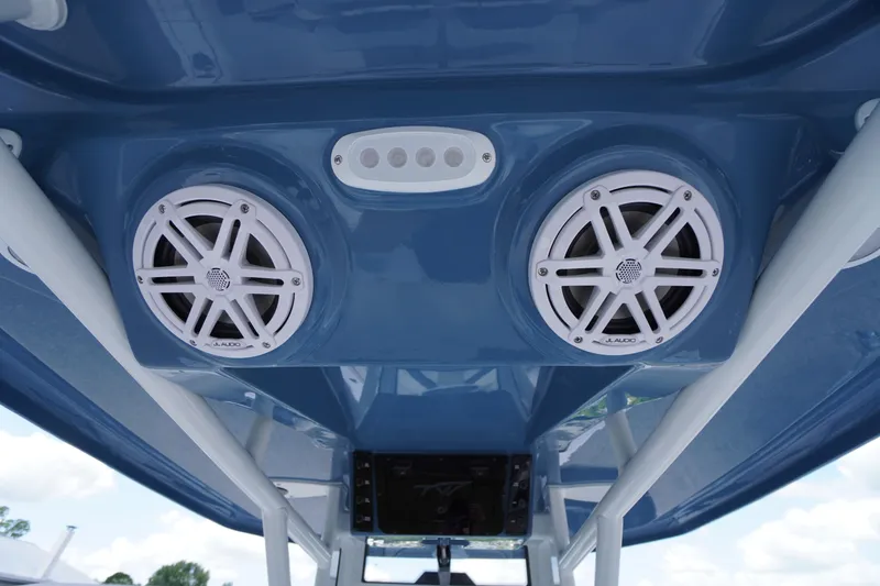 Slide: The Image of 2026 Tidewater 232 LXF boat speakers and lighting on blue interior ceiling. - 61