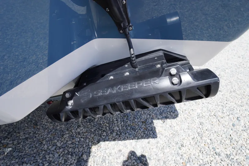 Slide: The Image of 2026 Tidewater 232 LXF boat with Seakeeper stabilizer on gravel surface. - 71