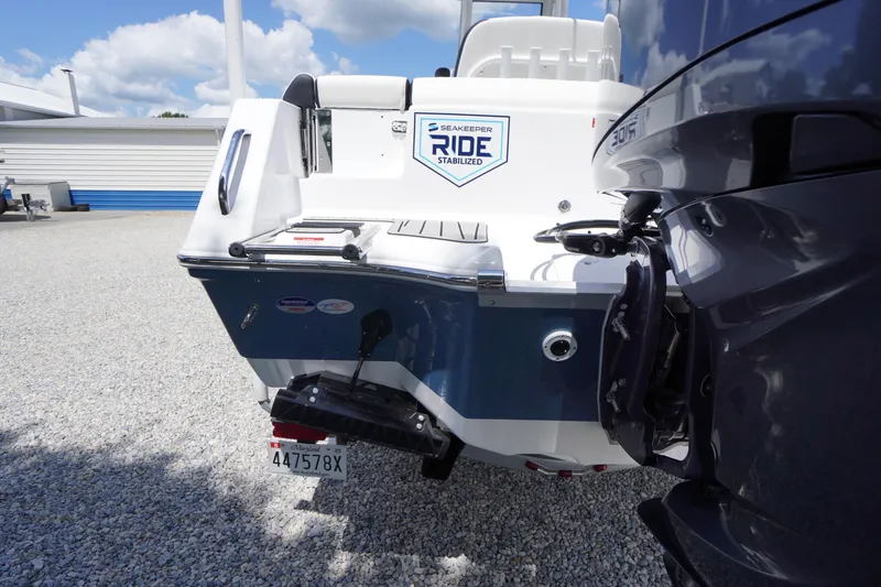 Slide: The Image of 2026 Tidewater 232 LXF boat with Seakeeper Ride Stabilized feature, rear view. - 72