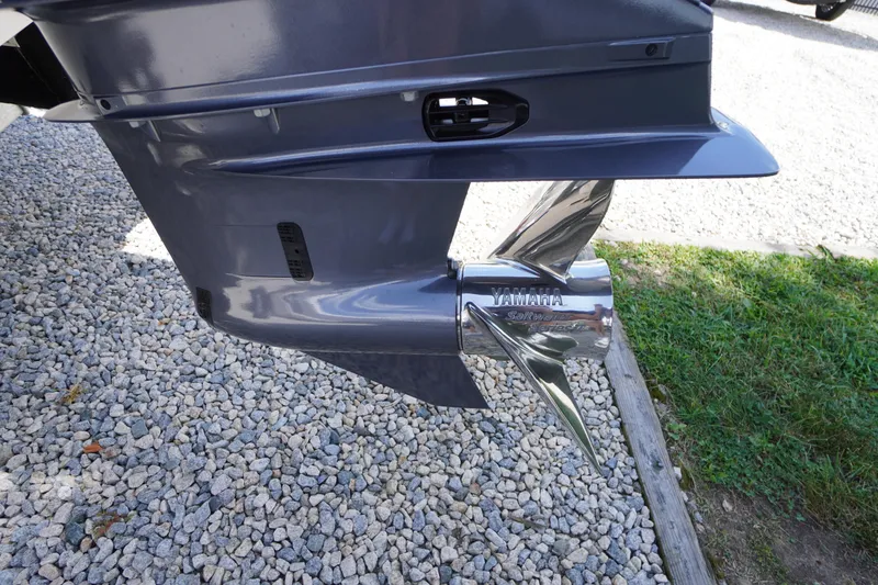 Slide: The Image of 2026 Tidewater 232 LXF boat with Yamaha Saltwater Series propeller on gravel. - 78