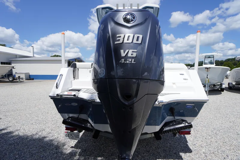 Slide: The Image of 2026 Tidewater 232 LXF boat with Yamaha 300 V6 engine, displayed outdoors. - 79