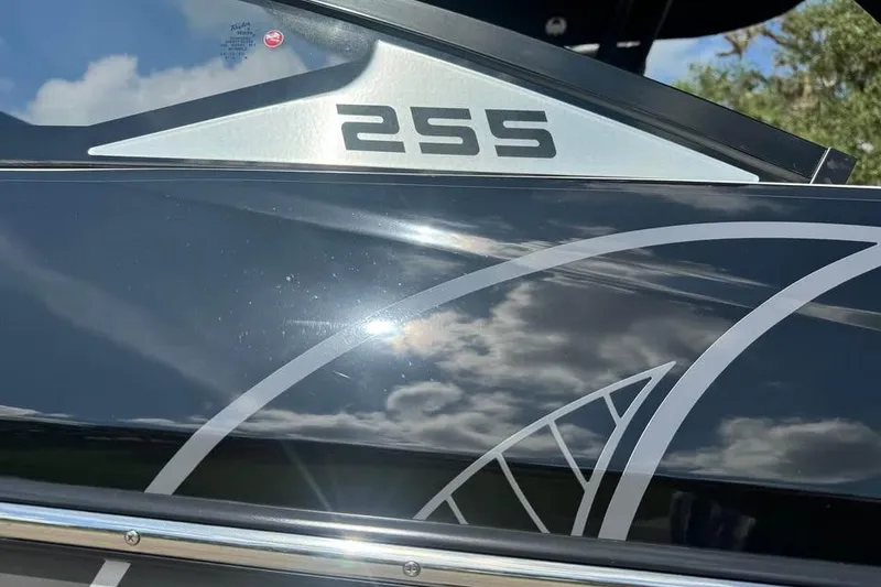 Slide: The Image of 2023 Scarab 255 ID boat with sleek black design and modern graphics. - 16