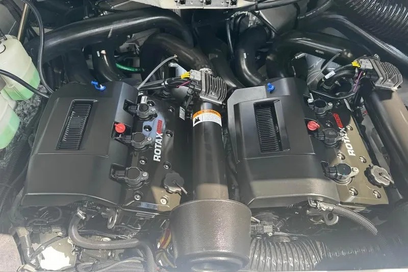 Slide: The Image of 2023 Scarab 255 ID engine compartment featuring dual Rotax engines. - 18