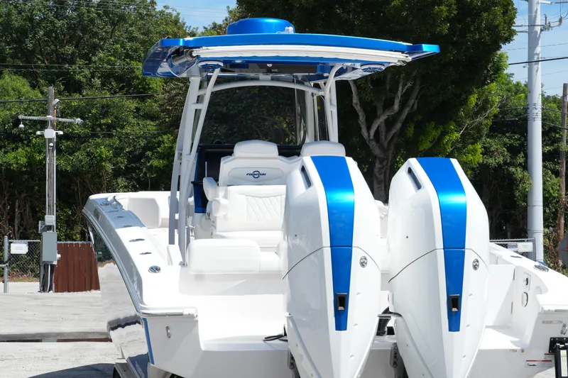 Slide: The Image of 2023 Fountain 34 Center Console boat with dual engines, blue accents, and sleek design. - 15