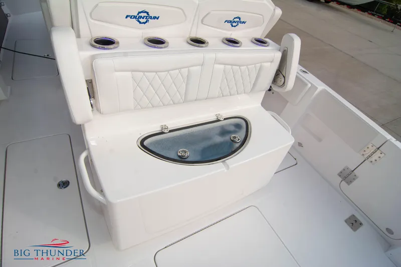 Slide: The Image of 2023 Fountain 34 CC boat seating with cup holders and storage compartment. - 39