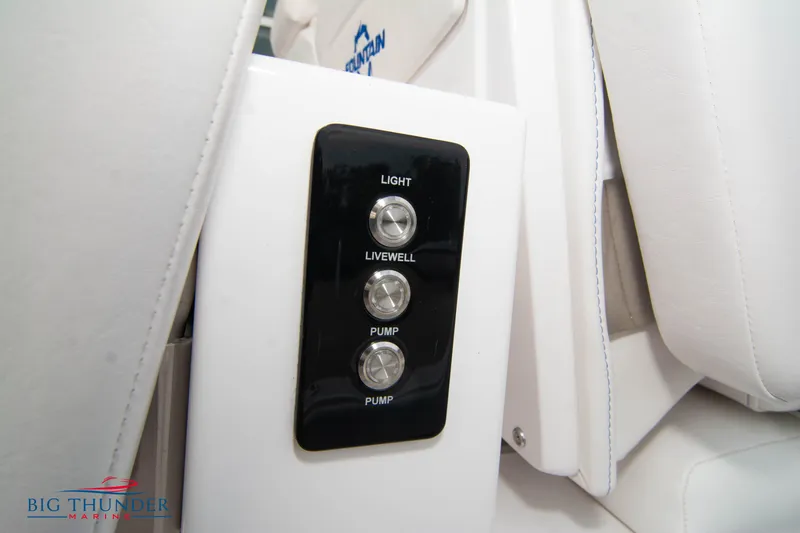 Slide: The Image of Control panel on 2023 Fountain 34 CC boat with light, livewell, and pump switches. - 41