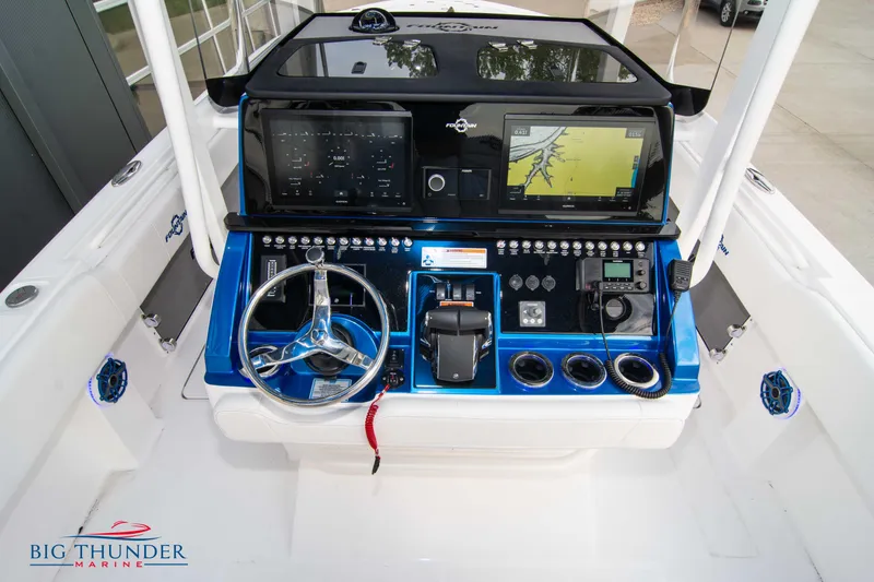 Slide: The Image of 2023 Fountain 34 CC boat dashboard with advanced navigation and control systems. - 43