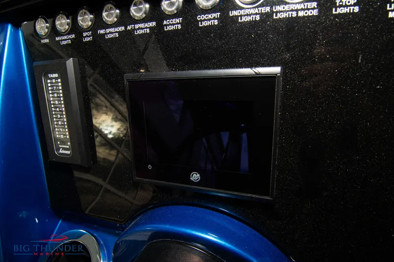 Slide: The Image of Control panel of 2023 Fountain 34 CC boat with various light switches. - 49