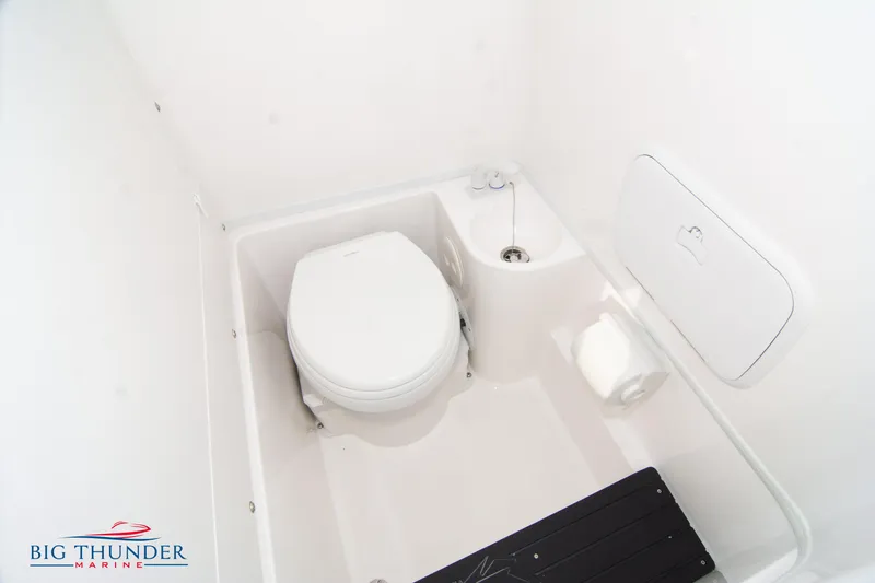 Slide: The Image of 2023 Fountain 34 CC boat bathroom interior with toilet and sink. - 61