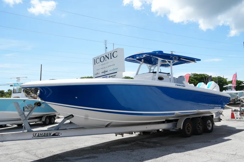 Slide: The Image of 2023 Fountain 34 Center Console boat on trailer at Iconic Marine dealership. - 7