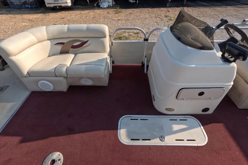 Slide: The Image of 2006 PlayCraft Sunfish 2400 boat interior with seating and control console. - 12