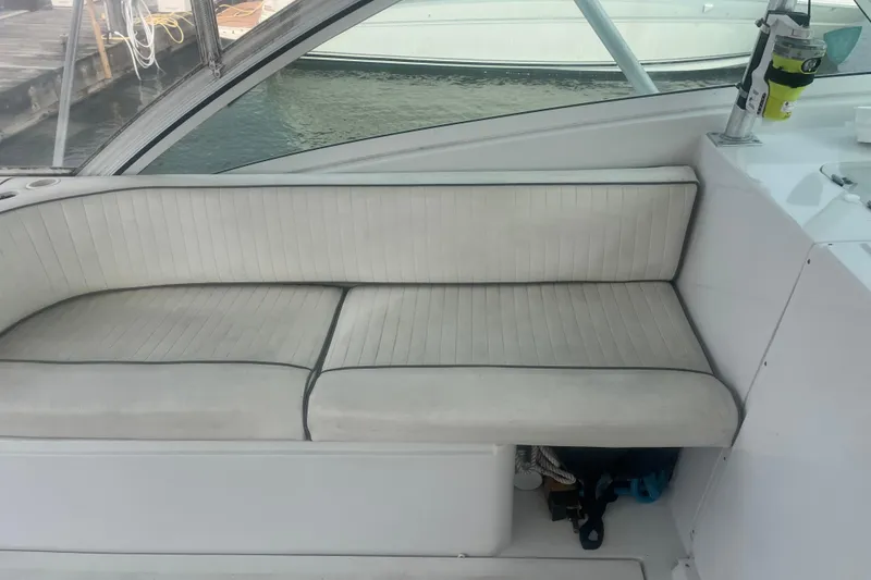 Slide: The Image of White cushioned seating on a 1998 Luhrs 36 Open boat, dockside view. - 3