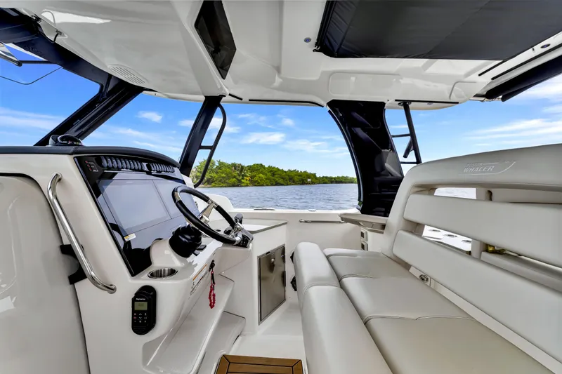 Slide: The Image of Interior of 2023 Boston Whaler 350 Realm boat with modern helm and seating. - 20