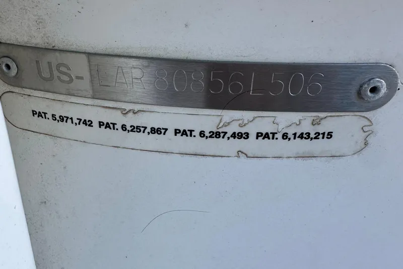 Slide: The Image of 2006 Larson Senza 206 boat identification plate with patent numbers visible. - 19