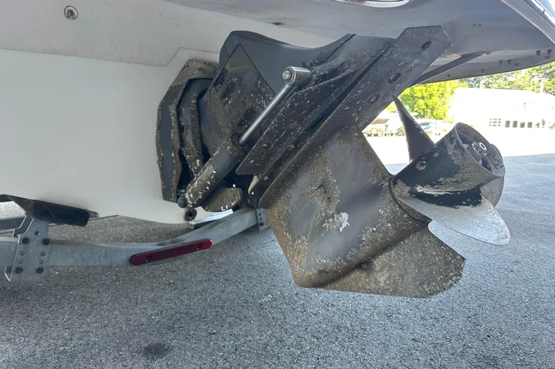 Slide: The Image of 2006 Larson Senza 206 boat propeller with visible wear and marine growth. - 5