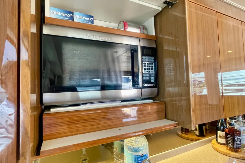 Slide: The Image of Cuisinart microwave in 2005 Viking 48 Convertible yacht kitchen, with wooden cabinetry. - 10