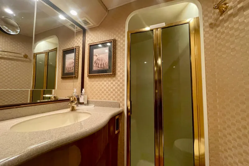 Slide: The Image of Luxurious bathroom in 2005 Viking 48 Convertible yacht with elegant fixtures and decor. - 13