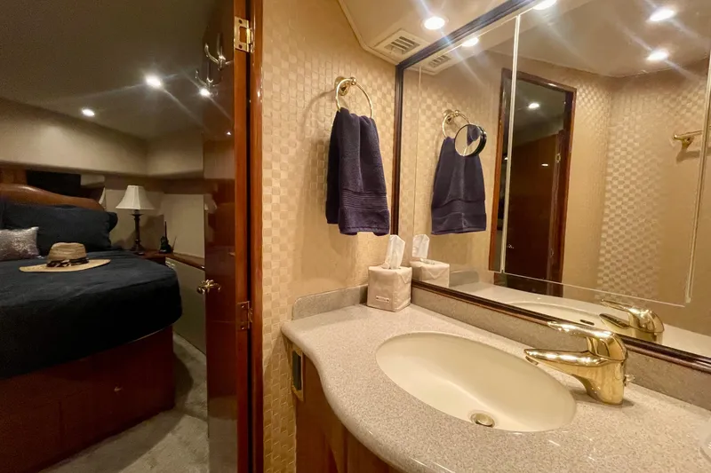 Slide: The Image of Luxurious bathroom and bedroom interior of a 2005 Viking 48 Convertible yacht. - 15