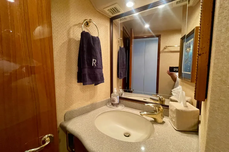 Slide: The Image of Luxurious bathroom in 2005 Viking 48 Convertible yacht with elegant fixtures and decor. - 21