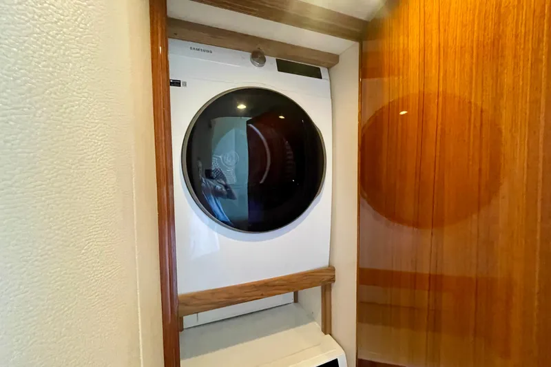 Slide: The Image of Laundry area with Samsung washer in 2005 Viking 48 Convertible yacht. - 26