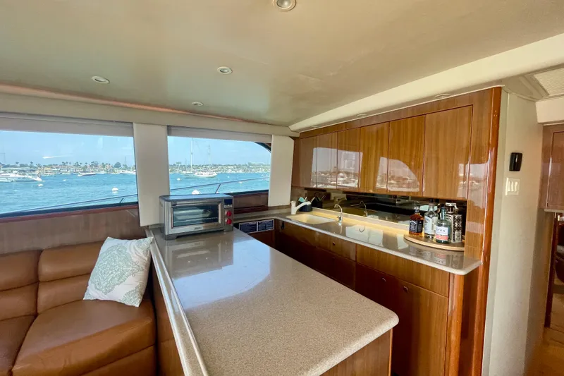 Slide: The Image of Luxurious interior of a 2005 Viking 48 Convertible yacht with kitchen and ocean view. - 30
