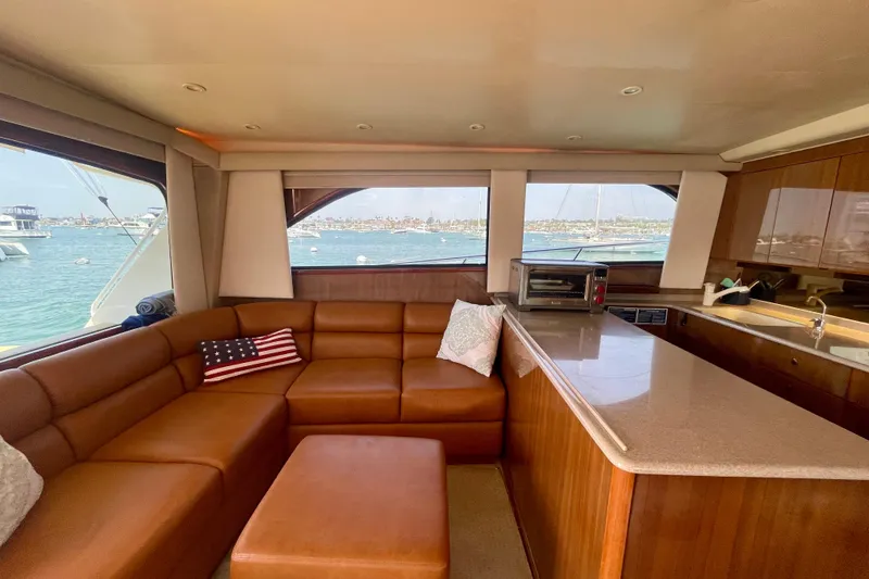 Slide: The Image of Interior of 2005 Viking 48 Convertible yacht with leather seating and ocean view. - 31