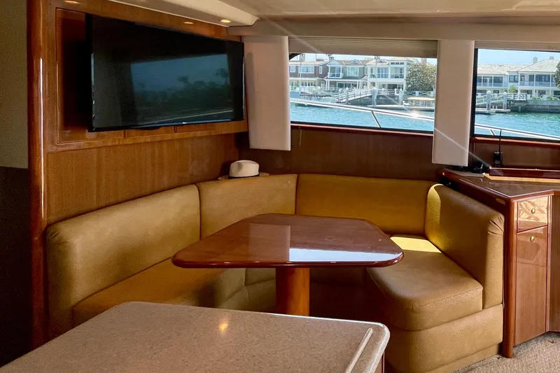 Slide: The Image of Luxurious interior of 2005 Viking 48 Convertible yacht with cozy seating and waterfront view. - 41