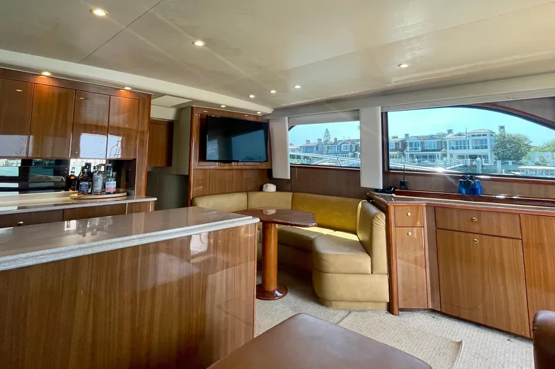 Slide: The Image of Luxurious interior of 2005 Viking 48 Convertible yacht with wood finishes and seating area. - 42